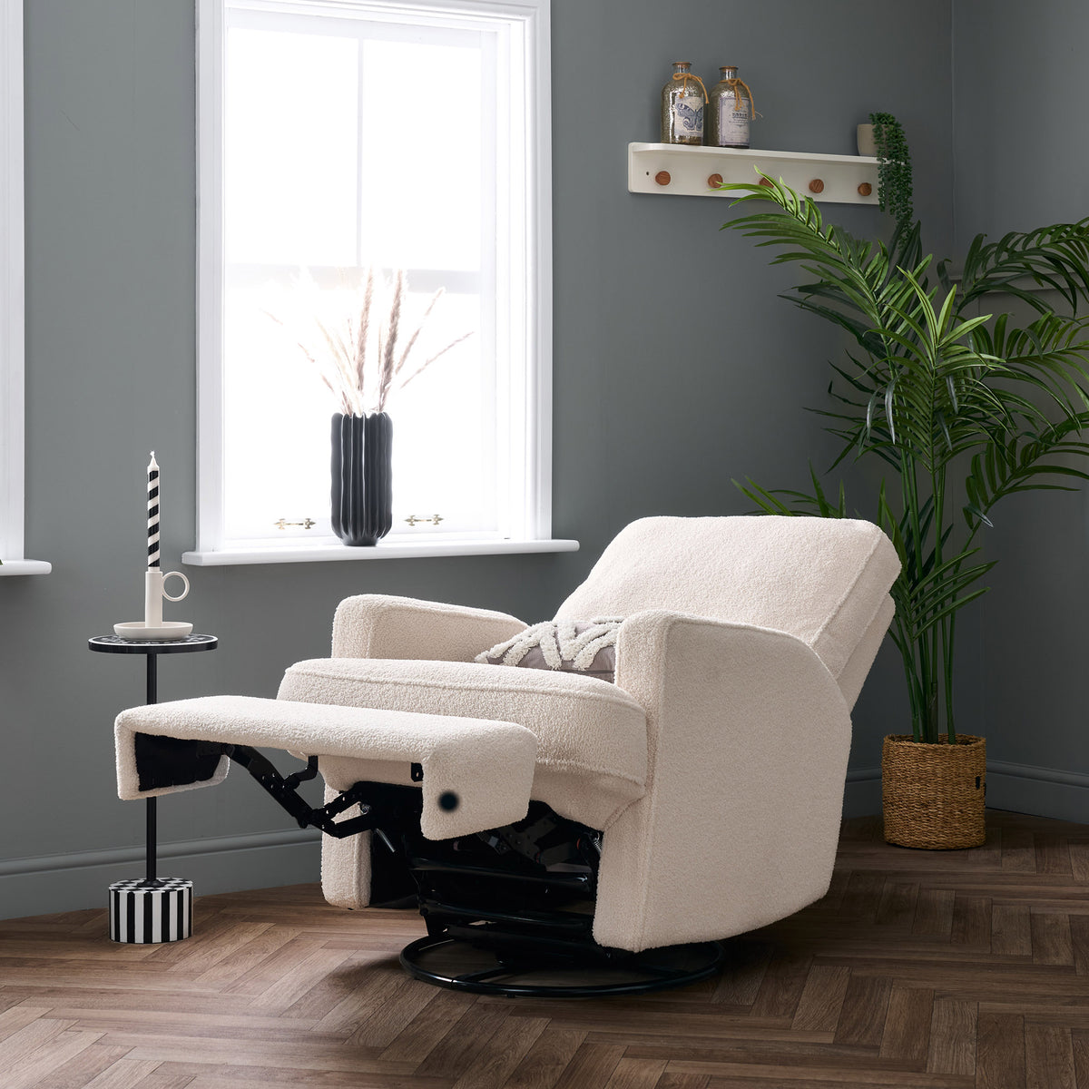 fully reclined Obaby Madison electric swivel glider recliner nursing chair in Ivory teddy fabric in modern nursery