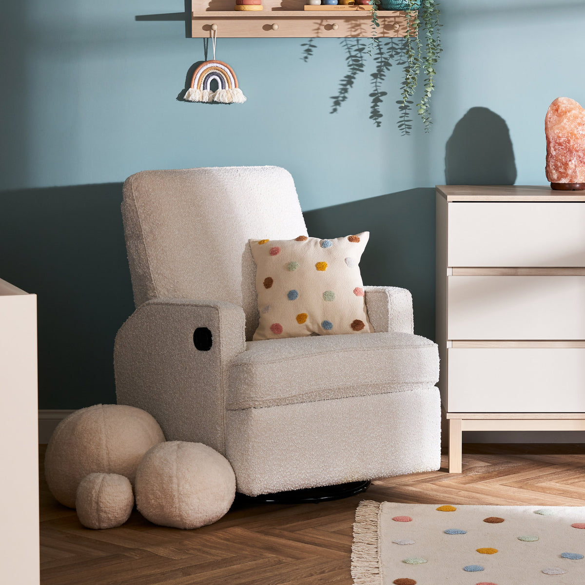 Obaby Madison swivel glider recliner nursing chair with textured Bouclé Style upholstery in baby nursery
