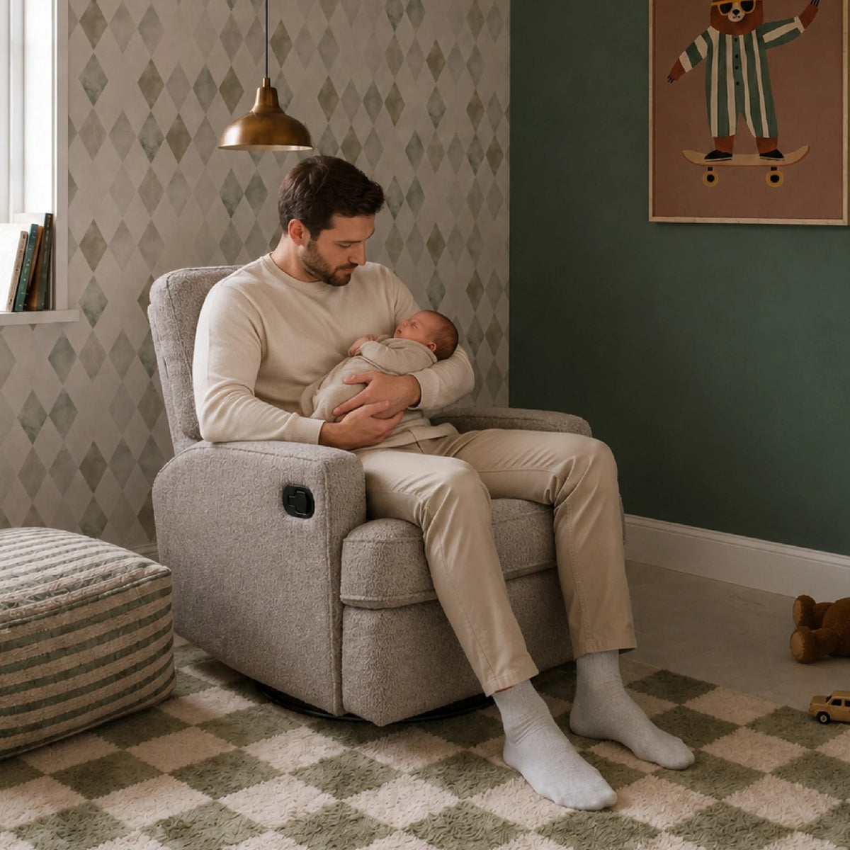 man sitting in a Obaby Madison Chenille Mushroom nursing chair while holding a baby in a cosy nursery bedroom