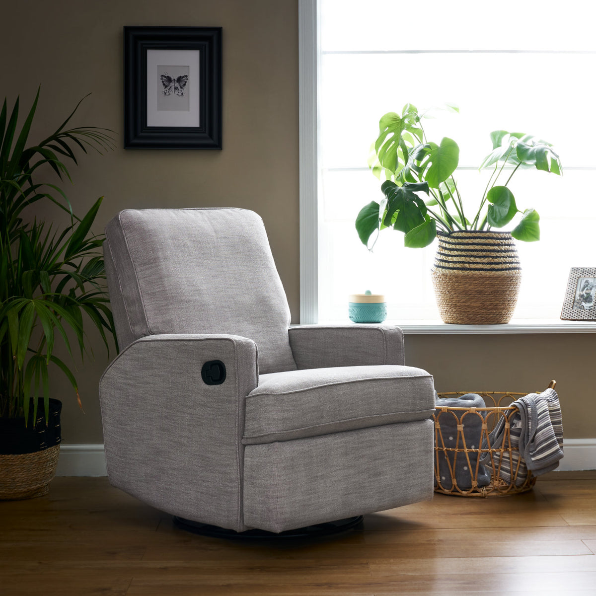 Obaby Madison swivel glider recliner nursing chair in Pebble upholstery with padded seat and backrest in baby nursery