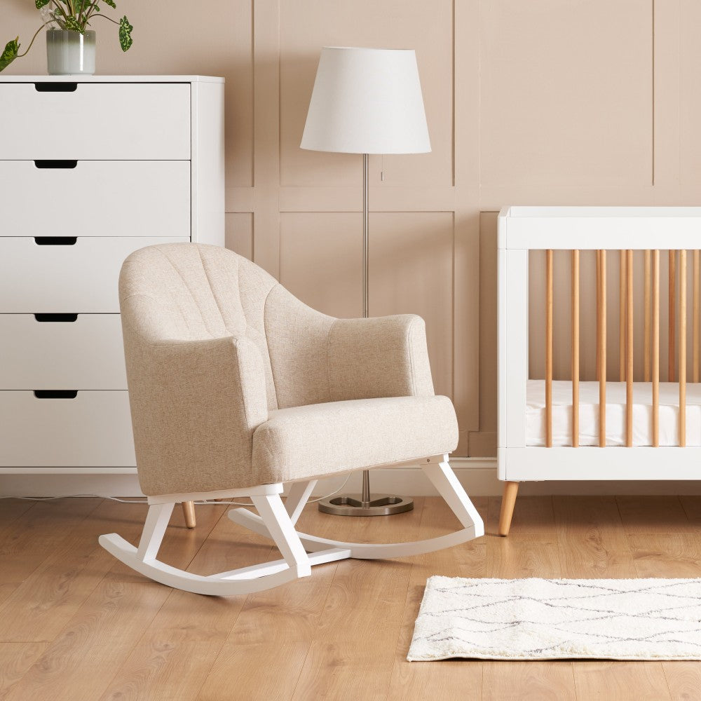 Obaby Round Back nursing rocking chair in Oatmeal next to cot in baby nursery