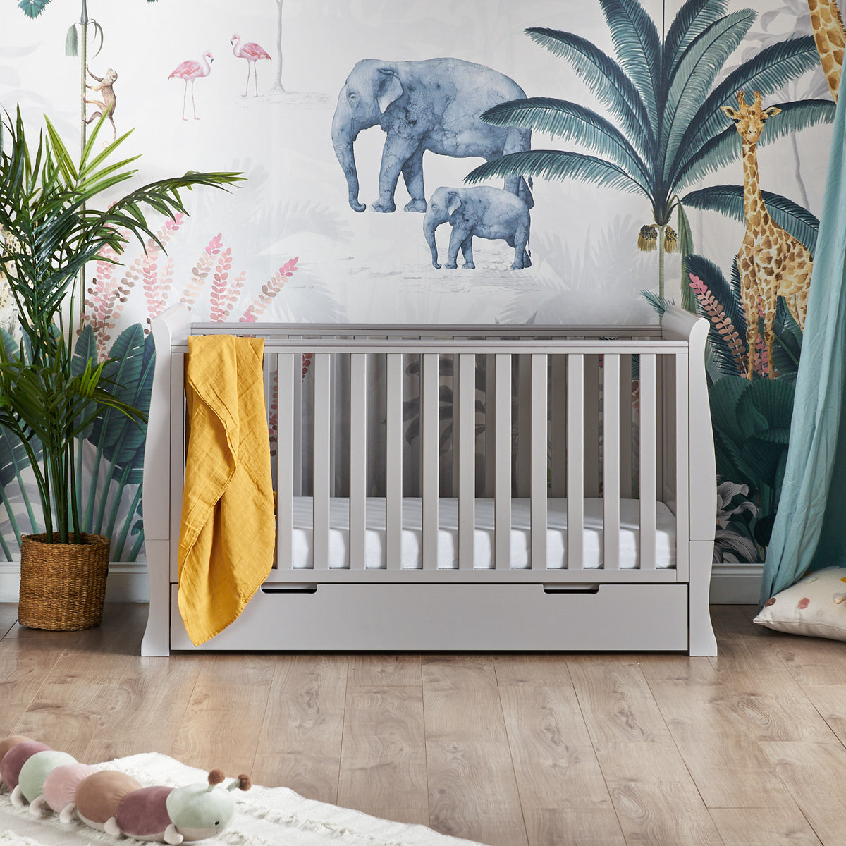 Obaby Stamford Classic sleigh cot bed in warm grey and built in under bed storage drawer in baby nursery