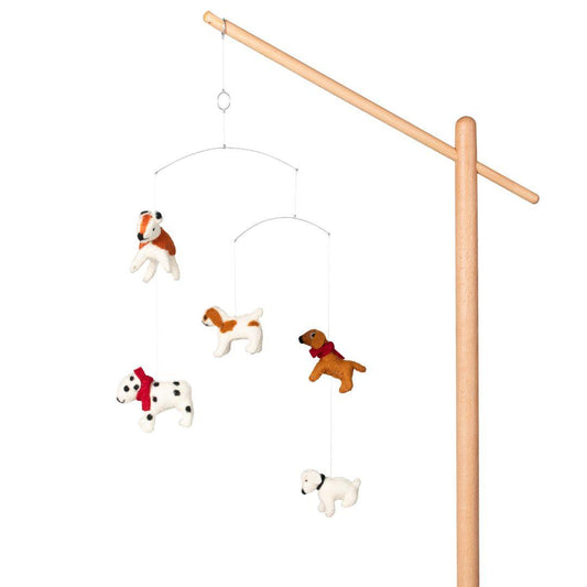 quax baby cot mobile dogs hanging from light coloured wooden stand on plain white background