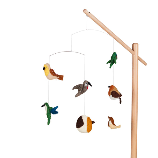 quax birds baby mobile hanging from wooden stand on plain white background