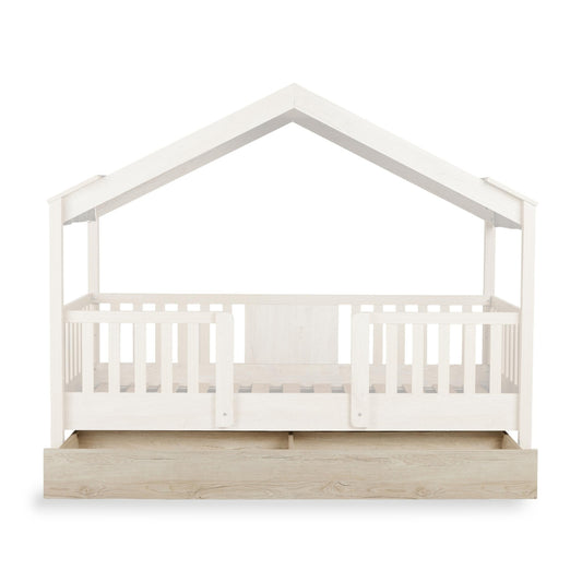 quax chalet underbed drawer in natural wood underneath faded out house bed on plain white background