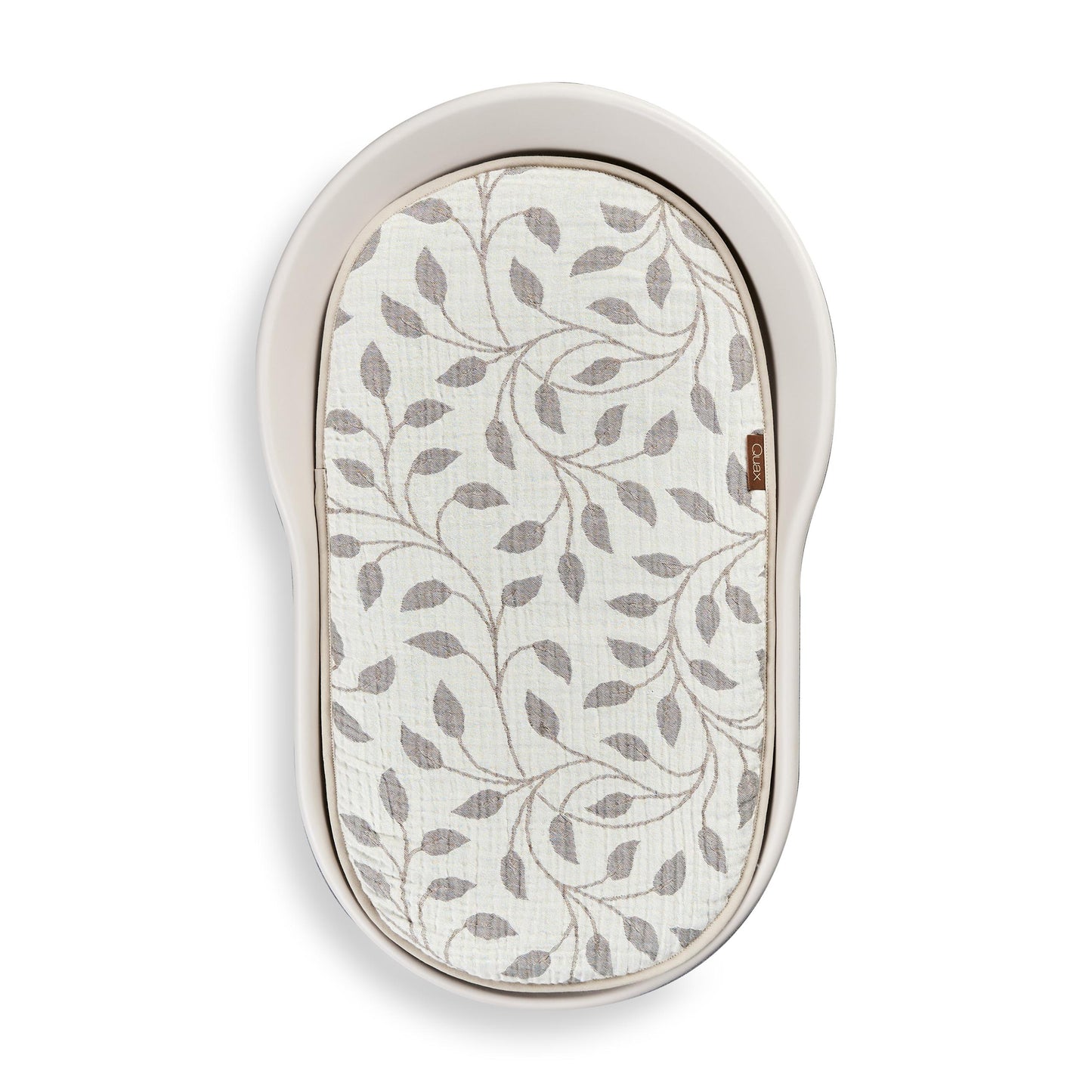 Quax inlay cushion with leaf pattern in quax mamee changing pad on white background