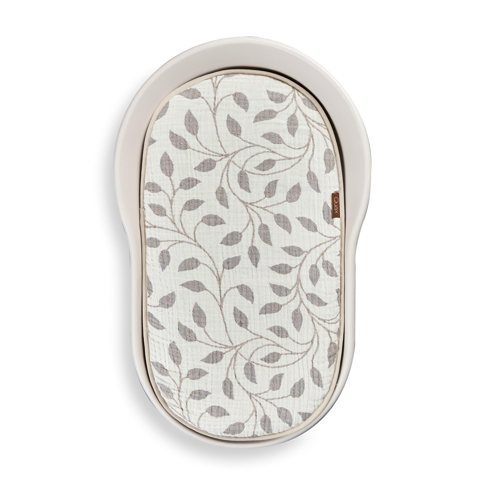 Quax inlay cushion with leaf pattern in quax mamee changing pad on white background