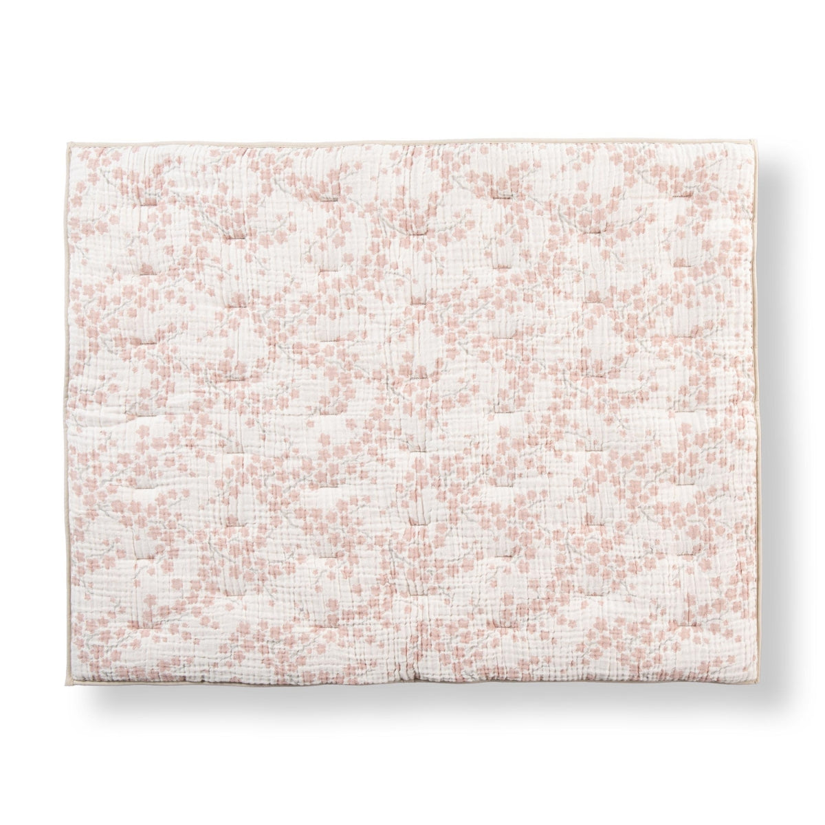 quax natural playpen mat with pink and white blossom floral print on white background