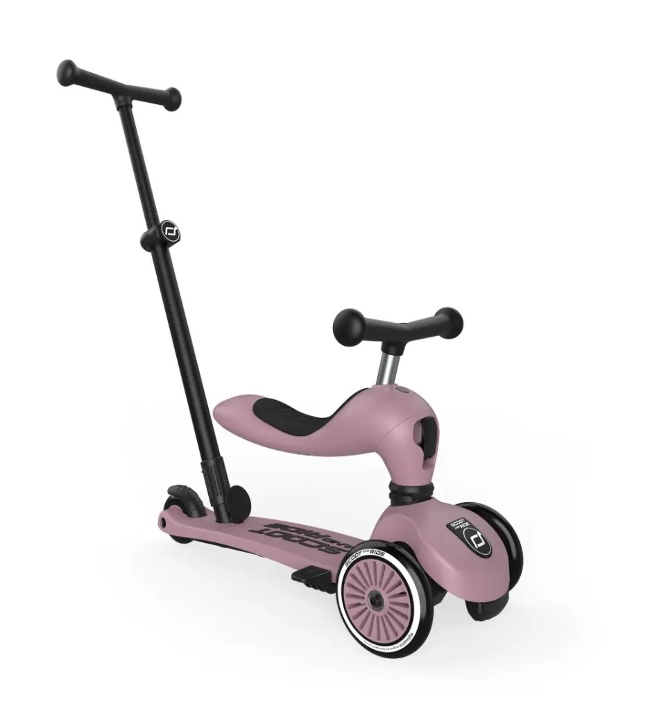 Pink children's highwaykick push and go scooter with a black handlebar on a white background