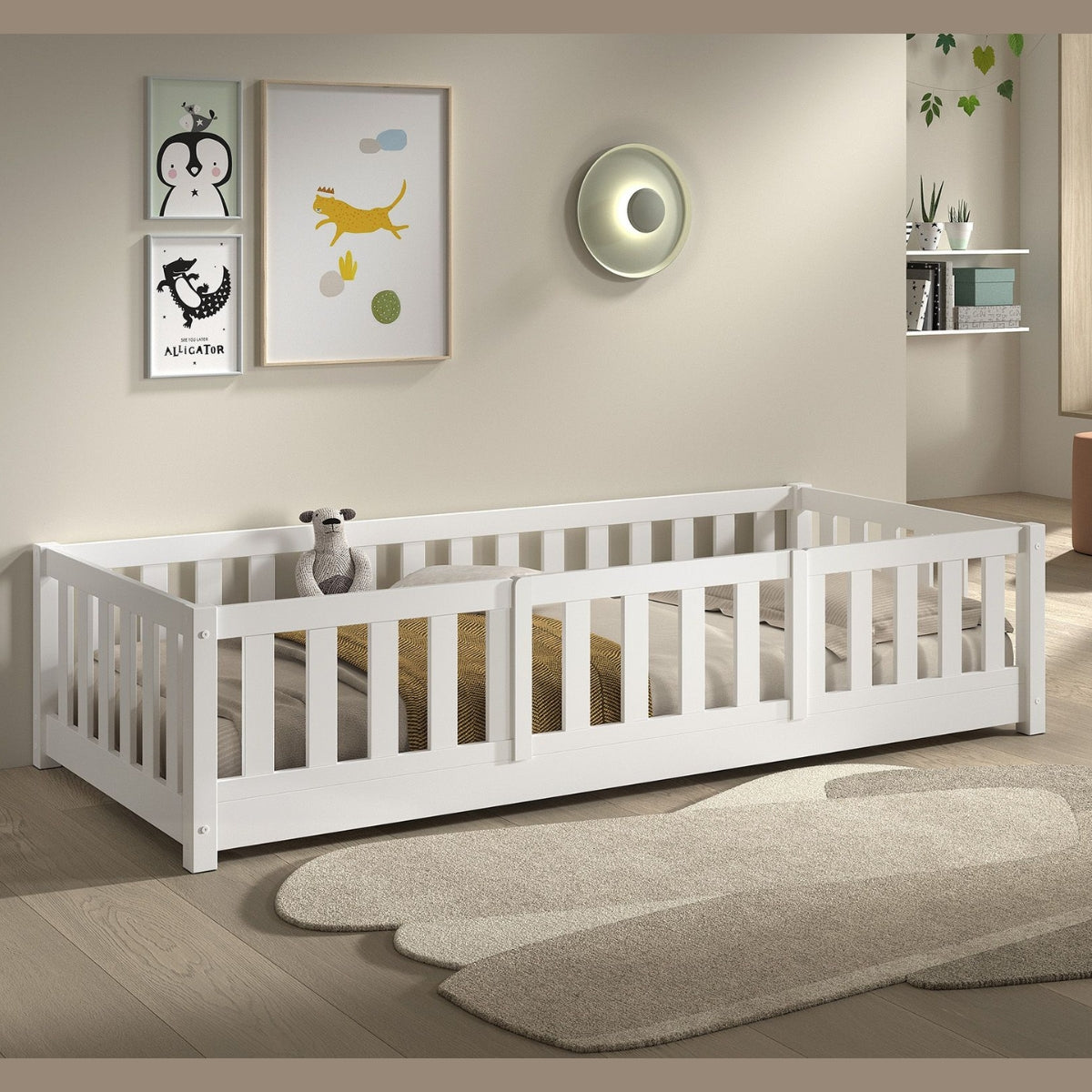white toddler Montessori floor bed with raised sides and full safety bed guard in modern bedroom