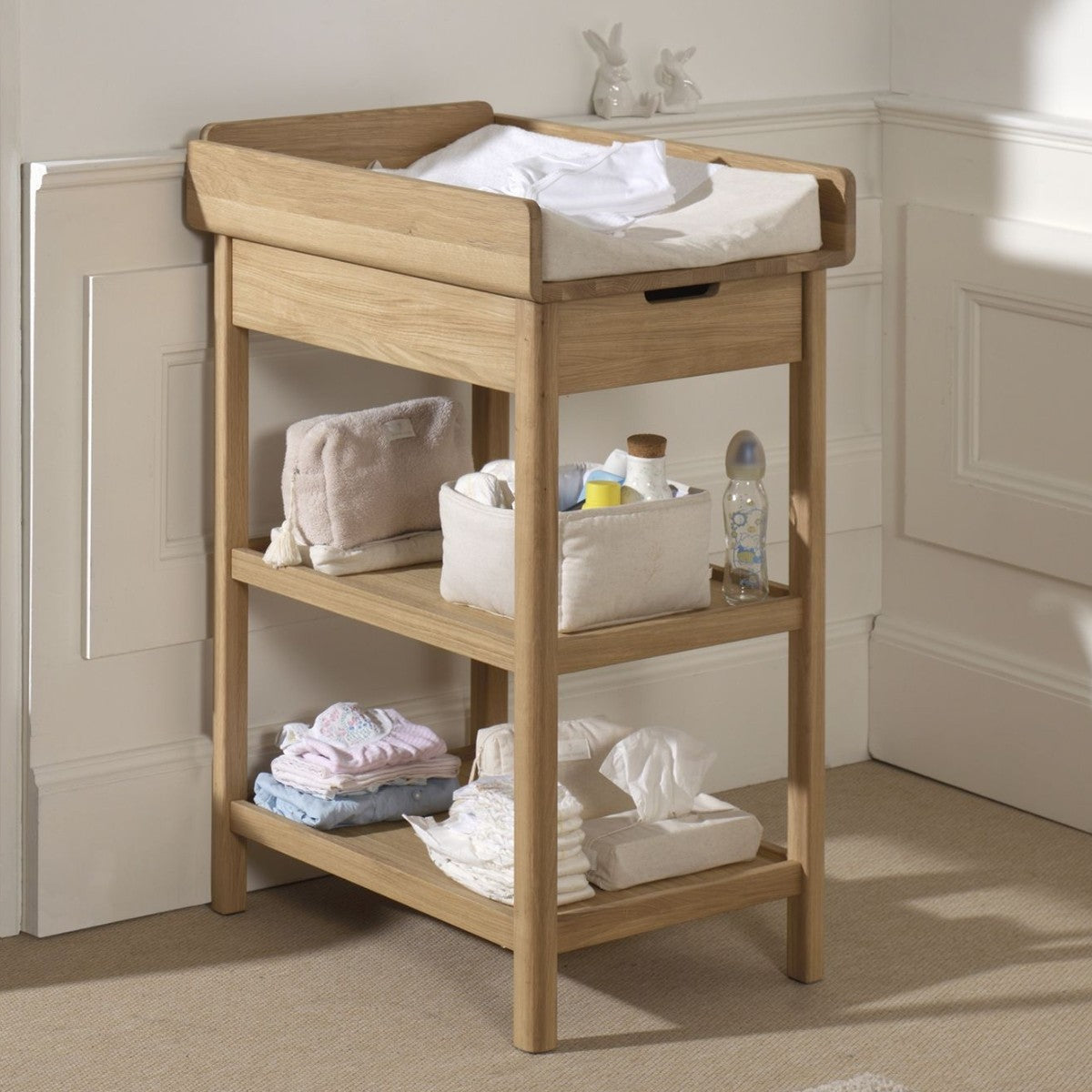 solid oak wood VIPACK FORREST baby changing table with nappies and baby changing essentials on